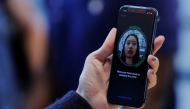 A woman sets up her facial recognition as she looks at her Apple iPhone X at an Apple store in New York, November 3, 2017. Reuters/Lucas Jackson