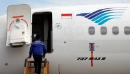 A technician prepares to check Garuda Indonesia's Boeing 737 Max 8 airplane parked at the Garuda Maintenance Facility AeroAsia, at Soekarno-Hatta International airport near Jakarta, Indonesia, March 13, 2019. Reuters/Willy Kurniawan
