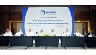 Sheikh Suhaim bin Abdullah bin Khalifa Al Thani (fourth left), Vice-Chairman of Mannai Corporation, and Mohamed Ali M Al Kubaisi (fourth right), Director, with other Board members during the Ordinary and Extraordinary General Assembly meeting of Mannai Co