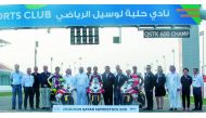 Top three riders of the QSTK600 Championship, Saeed Al Sulaiti, Abdulla Al Qubaisi and Mashel Al Naimi pose for a photograph with FIM ASIA President Stephan Carapiet, Deputy President Stan Yasuhiro, Qatar Motor and Motorcycle Federation President Abdulrah