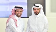 Omar Abdul Aziz Al Meer (right), QIIB Head (Business Development), receiving a commemorative shield from the President of Qatar University, Dr Hassan Rashid Al Derham. 
