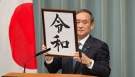 Japan's Chief Cabinet Secretary Yoshihide Suga announces the new era name 