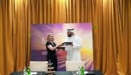 Margret Franco (left), Senior Vice President - Europe, Middle East & Africa, Marketing at Dell Technologies; and Hassan Ibrahim Al Asmakh, Vice-President and CEO at Regency Group Holding, exchanging documents after the signing ceremony in Doha, yesterday.