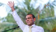 FILE PHOTO:  Former president of the Maldives Mohamed Nasheed waves as he addresses the country after returning from exile to the Maldives, in Male.  AFP / Ahmed SHURAU
