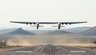 This handout photograph obtained courtesy of Stratolaunch shows the Stratolaunch plane flying above the California desert, April 13, 2019, the first test flight of the US company's gigantic aircraft whose wingspan is almost half that of an Airbus A380. (A