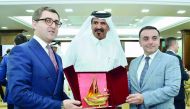 Qatar Chamber’s First Vice-Chairman Mohamed bin Ahmed Towar Al Kuwari (centre) honouring the head of the Azeri delegation, Yusif Abdullayev Ikram Oglu (left), and Ambassador of Azerbaijan to Qatar, Rashad Ismayilov with a memento, at QC headquarters, yest