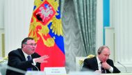 Russian President Vladimir Putin (R) listens to Total CEO Patrick Pouyanne during a meeting with French business leaders at the Kremlin in Moscow on April 18, 2019. AFP / pool / Alexander Nemenov
