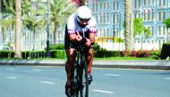 An athlete takes part in the Qatar National Triathlon Series at The Pearl-Qatar.

