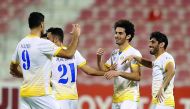Al Gharafa’s Mehdi Taremi (left) is congratulated by team-mates after the Iranian forward scored their fifth goal against Al Khor in yesterday’s Amir Cup match.