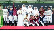 The champion riders of the second edition of the Hathab Equestrian Tour pose for a photograph with Hamad Abdulrahman Al Attiyah, President of the Qatari and Asian Equestrian Federations, and QEF and Al Shaqab officials yestertday.