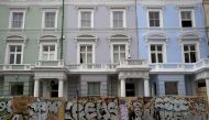 People walk past boarded-up houses ahead of the Notting Hill, Carnival in London, Britain, August 27 2016. Reuters/Neil Hall