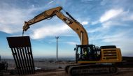 A construction crew works on replacing the US-Mexico border fence as seen from Tijuana in Baja, California state on January 9, 2019. AFP/Guillermo Arias