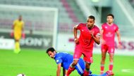 Al Duhail’s Youssef El Arabi (centre) scores against Al Shahania yesterday.