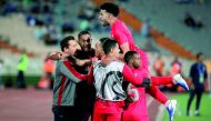 Al Duhail’s midfielder Edmilson Junior (centre) celebrates with team-mates after scoring a goal against Iran’s Esteghlal in their AFC Champions League group C match played in Tehran, yesterday. 