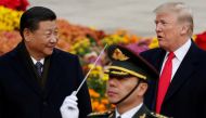 FILE PHOTO: U.S. President Donald Trump takes part in a welcoming ceremony with China's President Xi Jinping at the Great Hall of the People in Beijing, China, November 9, 2017. REUTERS/Damir Sagolj