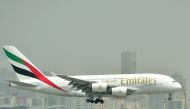 (FILES) In this file photo taken on September 14, 2017 an Airbus A380 of Emirates Airlines lands at the tarmac at Dubai's International Airport. AFP / GIUSEPPE CACACE