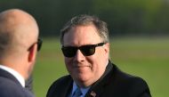 US Secretary of State Mike Pompeo walks to board a plane before departing from London Stansted Airport, north of London, on May 9, 2019. / AFP / POOL / MANDEL NGAN 
