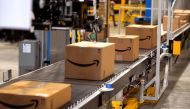 In this file photo, packed orders move down a converyor belt at the Amazon fullfillment center in Aurora, Colorado. (AFP / GETTY IMAGES NORTH AMERICA / Rick T. Wilking)