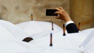 A man takes a picture before Pope Francis’ arrival at a welcoming ceremony at Wawel Royal Castle in Krakow, Poland, July 27, 2016. Reuters/Stefano Rellandini