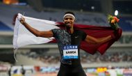 Qatar's Abderrahman Samba celebrates winning the Mens 400m Hurdles (REUTERS/Aly Song)