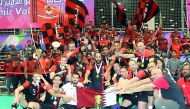 Al Rayyan volleyball team players and officials are seen in this photograph after winning the Amir Cup final against Police. 