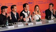 (FromL) US actor Brad Pitt, US actor Leonardo DiCaprio, US film director Quentin Tarantino, Australian actress Margot Robbie and British film producer David Heyman applaud during a press conference for the film 