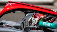 First placed Mercedes' British driver Lewis Hamilton reacts in his car with a red halo in tribute to late F1 legend Niki Lauda after winning the pole position during the qualifying session at the Monaco street circuit on May 25, 2019 in Monaco, ahead of t