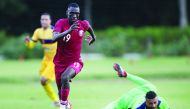 Qatar’s Almoez Ali (left) beats Club Madureira’s goalkeeper during their friendly match played in Mangaratiba, Rio de Janeiro, on Sunday. 