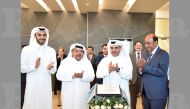 H E Ali bin Ahmed Al Kuwari, Minister of Commerce & Industry (second right); Qatar Businessmen Association Chairman Sheikh Faisal bin Qassim Al Thani (second left) and other officials during the event. 