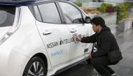 A technician cleans a modified Nissan Leaf driverless car in London, February 27, 2017.  Reuters/Peter Nicholls