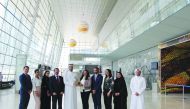 The team members of Qatar National Tourism Council, dmg Events Doha and DECC posing for a picture.