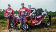 Nasser Saleh Al Attiyah and his co-driver Mathieu Baumel pose for a picture during their SxS buggy adventure at the 6 Hours Endurance Race in Orleans.
