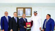 Mohammed bin Ahmed bin Towar Al Kuwari (second right), First Vice-Chairman of Qatar Chamber, handing a memento to the visiting Vice-Minister for Economic Affairs and Relations with the Dominican Community Abroad, Dr Carlos Gabriel Garcia, at QC headquarte