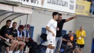 Al Sadd coach Xavi Hernandez bringing in debutant South Korean Nam Tae-Hee during the second half of their pre-season practice match against Palamos in Olot, Spain, on Sunday. 
