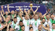 Algerian players and officials celebrate with the trophy after winning the 2019 Africa Cup of Nations title on Friday.