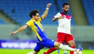 Al Gharafa’s Ahmed Alaaeldin (left) in action against Al Shahania captain Mostafa Jalal Jafri during their opening match of the QNB Stars League at Al Janoub Stadium yesterday. Picture: Twitter/ 
@alkasschannel 