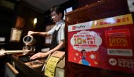 This photo taken on July 25, 2019 shows a notice for payment via PayPay -- a tie-up between Softbank and Yahoo -- displayed at a Koguma restaurant in Tokyo. AFP / Toshifumi Kitamura 