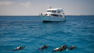Divers swim off the coast of Red Sea resort of Hurghada  Egypt on April 4 2019 AFP Mohamed el-Shahed