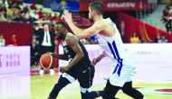 Kemba Walker of the US dribbles past Canada's Thomas Scrubb (R) during their friendly basketball match in Sydney on August 26, 2019. AFP / Saeed Khan 