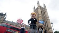 Protestors, with one of them dressed as Britain's Prime Minister Boris Johnson, demonstrate outside the Houses of the Parliament in London, Britain September 3, 2019. REUTERS/Simon Dawson