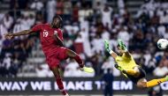 Qatar's forward Almoez Ali scores a goal during the second round Group E qualification football match for the 2022 Qatar FIFA World Cup between Qatar and Afghanistan at the Jassim bni Hamad Stadium in Doha on September 5, 2019. AFP