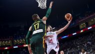 France's Nando De Colo (R) goes to the basket as Lithuania's Jonas Valanciunas tries to block during the Basketball World Cup Group L second round game between France and Lithuania in Nanjing on September 7, 2019. / AFP / WANG ZHAO