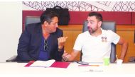 Al Sadd’s Spanish coach, Xavi Hernandez (right) speaks with an official during the co-ordination meeting hosted by Qatar Stars League at the Al Bidda Tower, in Doha, yesterday.