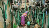 A woman uses a hand pump to fill up a container with drinking water in Chennai, as the city's water supplies ran low, India, June 25. Reuters/P. Ravikumar