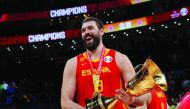 Spain's Marc Gasol celebrates with the trophy after winning the FIBA World Cup. Reuters/Kim Kyung-Hoon
