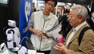 This photo taken on April 5, 2019 shows Palro, a robot developed by the Fujisoft company, on display during the Artificial Intelligence expo in Tokyo. AFP / CHARLY TRIBALLEAU /