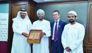 Qatar Chamber First Vice-Chairman, Mohamed bin Ahmed bin Towar Al Kuwari (left), presenting a memento to the visiting Omani officials.