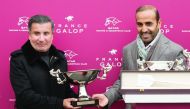HH Sheikh Mohamed Bin Khalifa Al Thani (left) receiving the winner’s trophy from Qatar Racing and Equestrian Club’s Chairman Issa Al Mohannedi after Amyr Du Soleil won the Qatar Arabian Trophy des Poulains (Gr1 PA) at Saint-Cloud, Paris, yesterday.