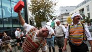 Monty Python fans dressed as the Gumbys gather in an attempt to set the world record for the largest gathering of people dressed as Gumbys as a part of the 50th anniversary of Monty Python's Flying Circus at the Roundhouse in London, Britain October 5, 20