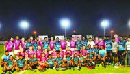 DRFC and SLAF team players and officials posing for a photograph after their friendly rugby encounter which took place at the Doha Rugby Football Centre. 